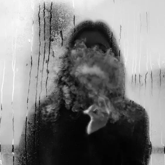 Obscured figure behind frosted glass conveying the stress of facing an AVO